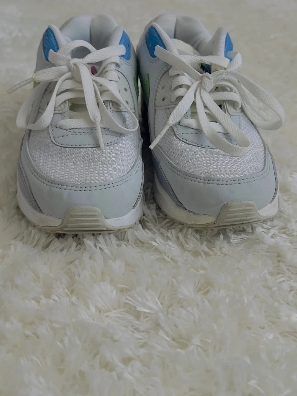 Nike Air Max 90 sneakers in white with blue and green accents